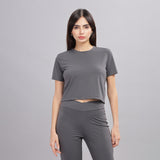 Front view of dark grey crop top and jogger set, women's