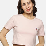 Women’s beige spandex crop top styled for a casual outfit, highlighting versatility and comfort.
