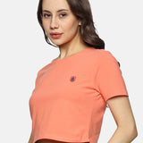 Model wearing a spandex crop top for women, styled with high-waisted leggings for a sporty look