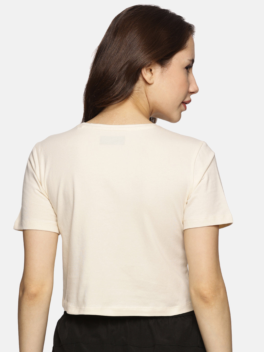 Back view of women’s spandex crop top in beige, showcasing a sleek and comfortable fit.