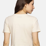 Back view of women’s spandex crop top in beige, showcasing a sleek and comfortable fit.