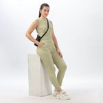 Side view of women’s light green joggers and crop top set, showcasing a flattering silhouette.