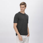 Back view of grey polyester shirt, showcasing durable stitching and a relaxed fit.
