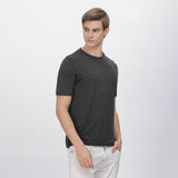 Back view of grey polyester shirt, showcasing durable stitching and a relaxed fit.