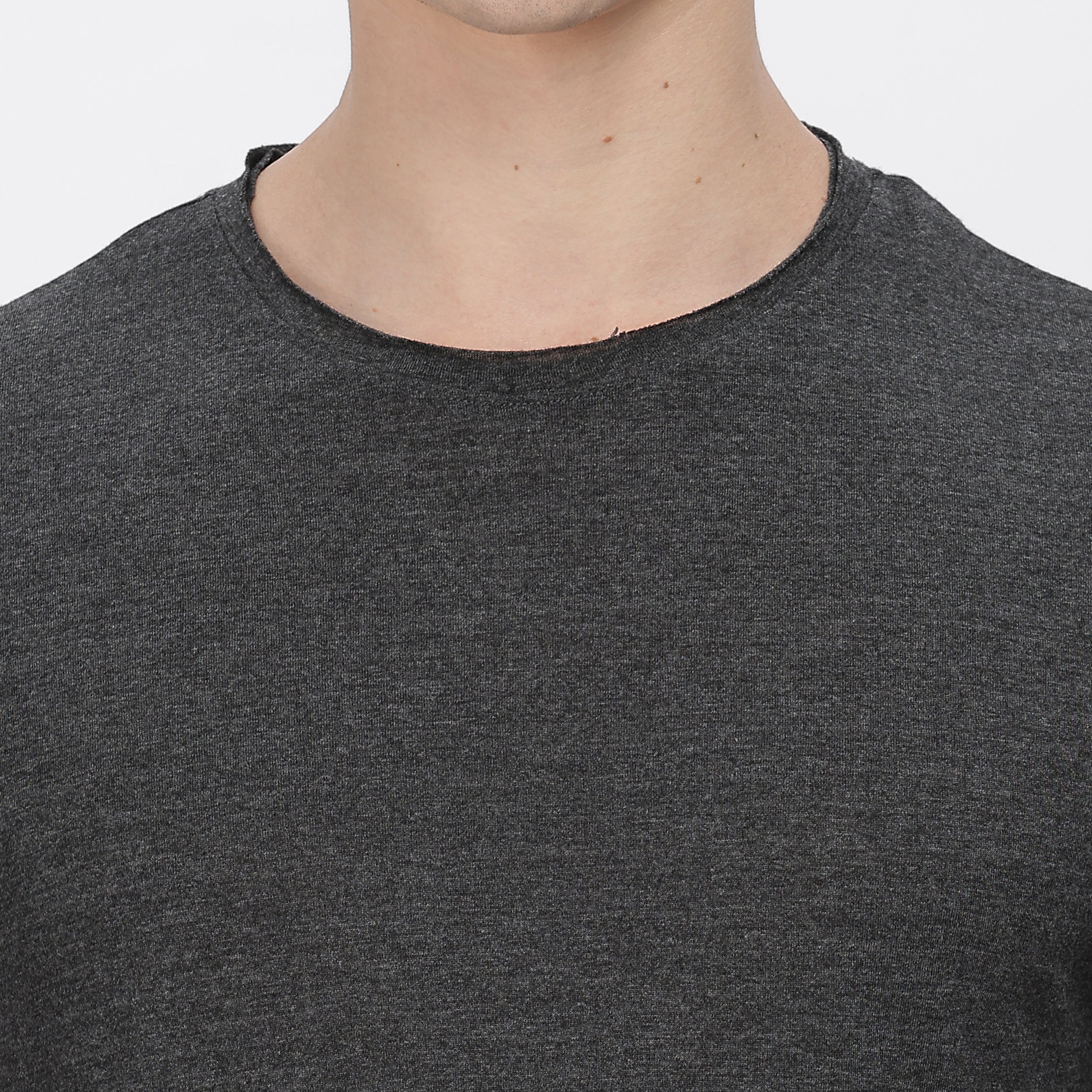 Close-up of grey polyester fabric, highlighting its soft texture and moisture-wicking properties.