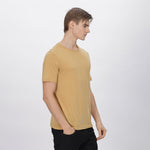 Versatile beige polyester shirt for men, suitable for work, travel, and casual outings.