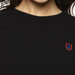 Close-up of black cotton spandex fabric, showing smooth texture and durable stitching.