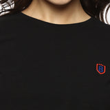Close-up of black cotton spandex fabric, showing smooth texture and durable stitching.