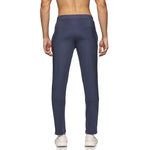 Close-up of men’s track pants in navy blue with zipper closure