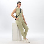 Model wearing light green joggers and crop top, styled for an effortless athleisure look.