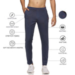 Navy blue track pants for men styled with casual sneakers