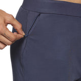 Side view of navy blue slim fit pants for men with secure zipper pockets