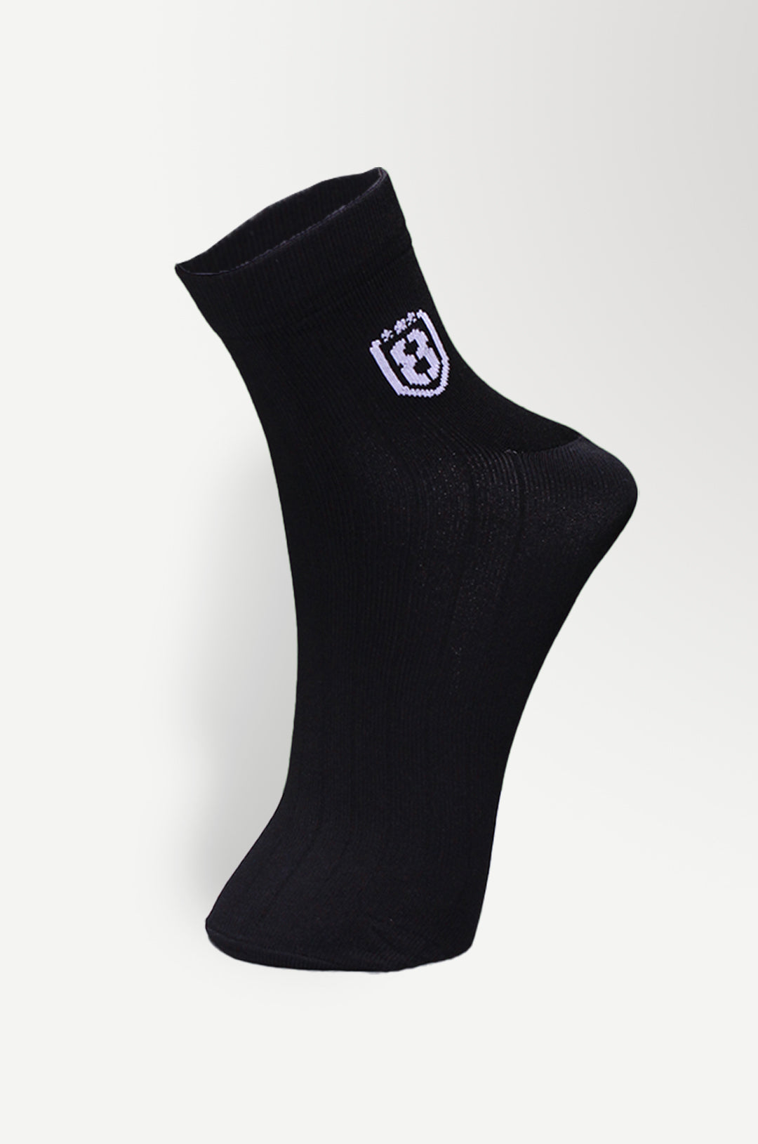 Back view of black nylon socks, featuring durable construction and moisture-wicking material.