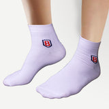 Back view of nylon white socks with rubber grip, designed for comfort and stability.