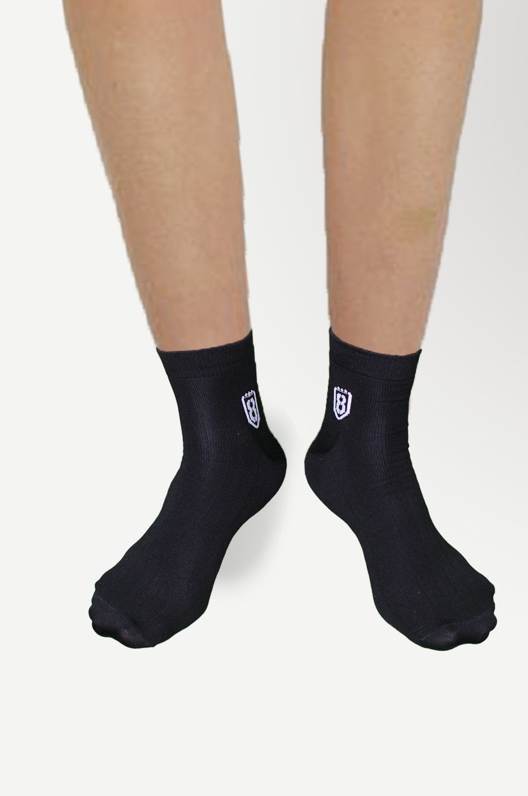 Folded pair of black nylon socks, highlighting premium quality and elastic support.