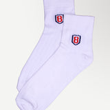 Folded pair of ankle high nylon white socks, showing premium quality and reinforced stitching.
