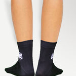 Model wearing black nylon socks, perfect for casual, sports, or everyday use