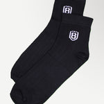 Black high-ankle nylon socks with a sleek design, ideal for running, training, or lounging.