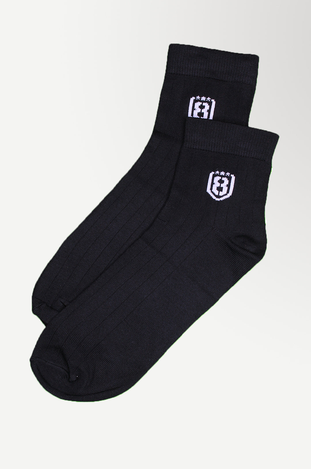 Black high-ankle nylon socks with a sleek design, ideal for running, training, or lounging.