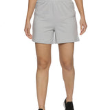 Flat lay of grey sports shorts for women paired with workout accessories.