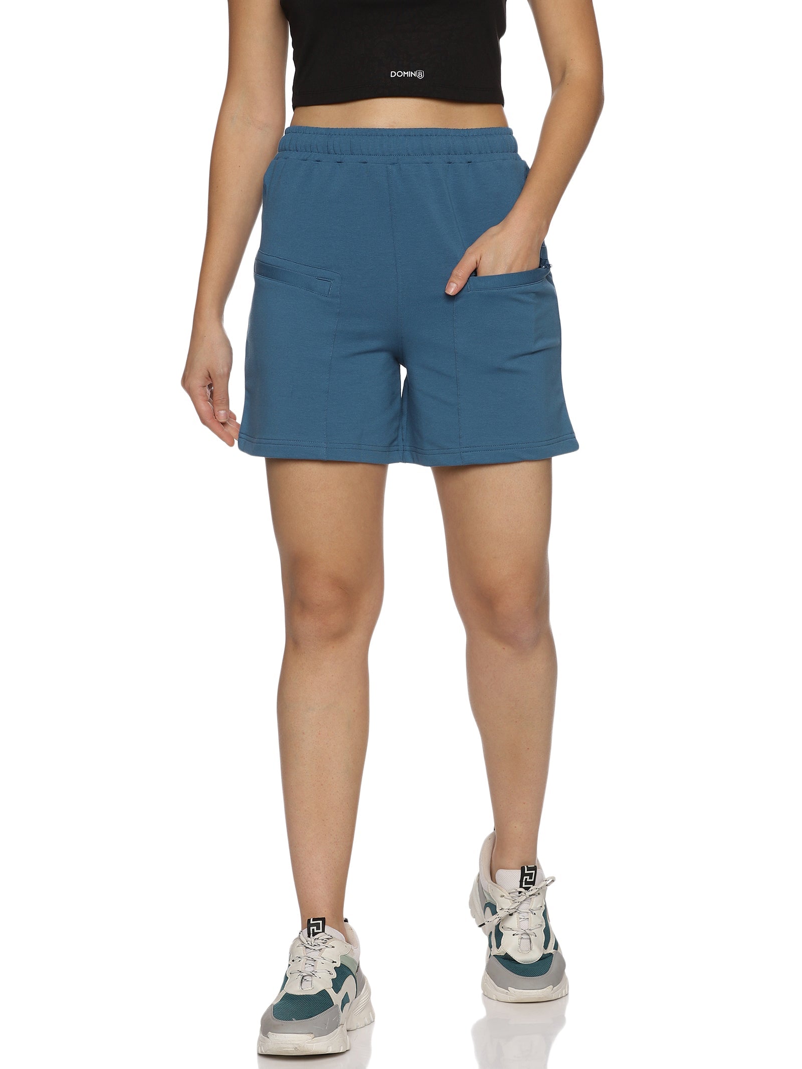 Close-up of breathable fabric and stitching on grey training shorts.