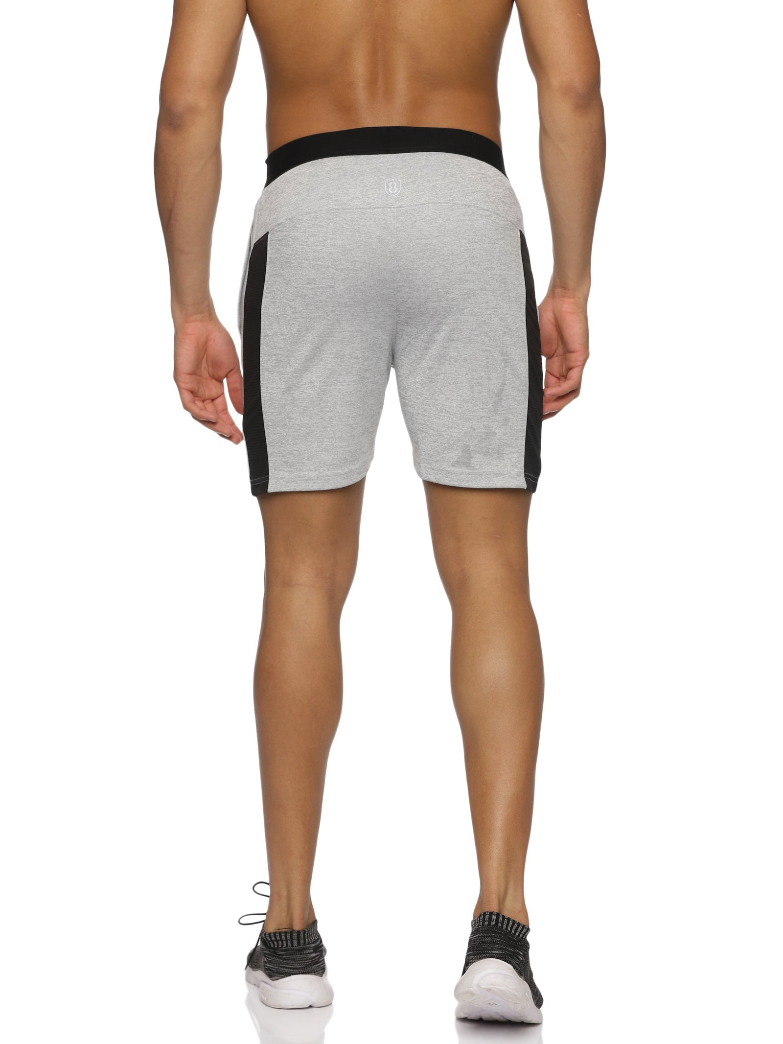 Close-up of side slit design on men's grey gym shorts for flexibility.