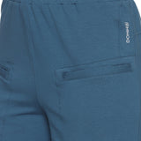 Close-up of breathable fabric and stitching on grey training shorts.