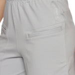 Side profile of women's grey elastic sports shorts for workouts.