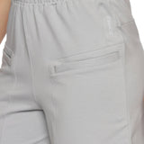 Side profile of women's grey elastic sports shorts for workouts.