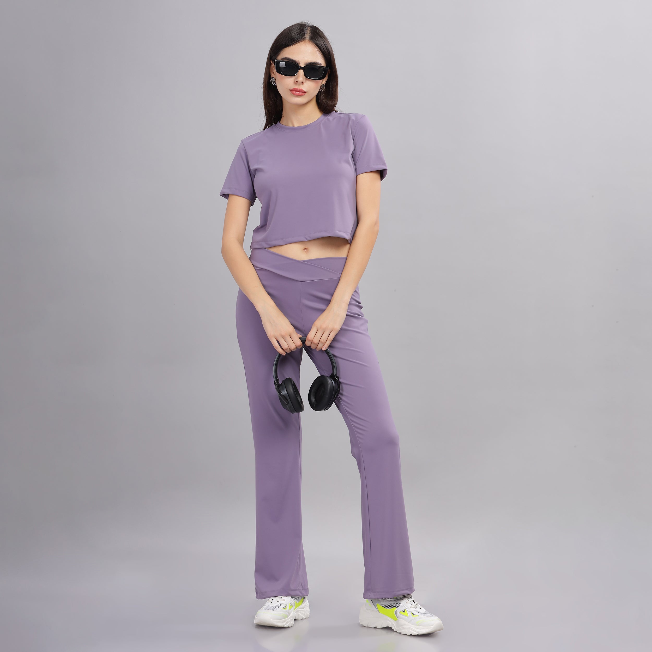 Front view of Purple crop top and jogger set, women's nylon activewear.