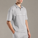 Dropped Shoulder Half-Zip Polo T Shirt with minimal graphic print