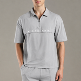 Dropped Shoulder Half-Zip Polo T Shirt with minimal graphic print