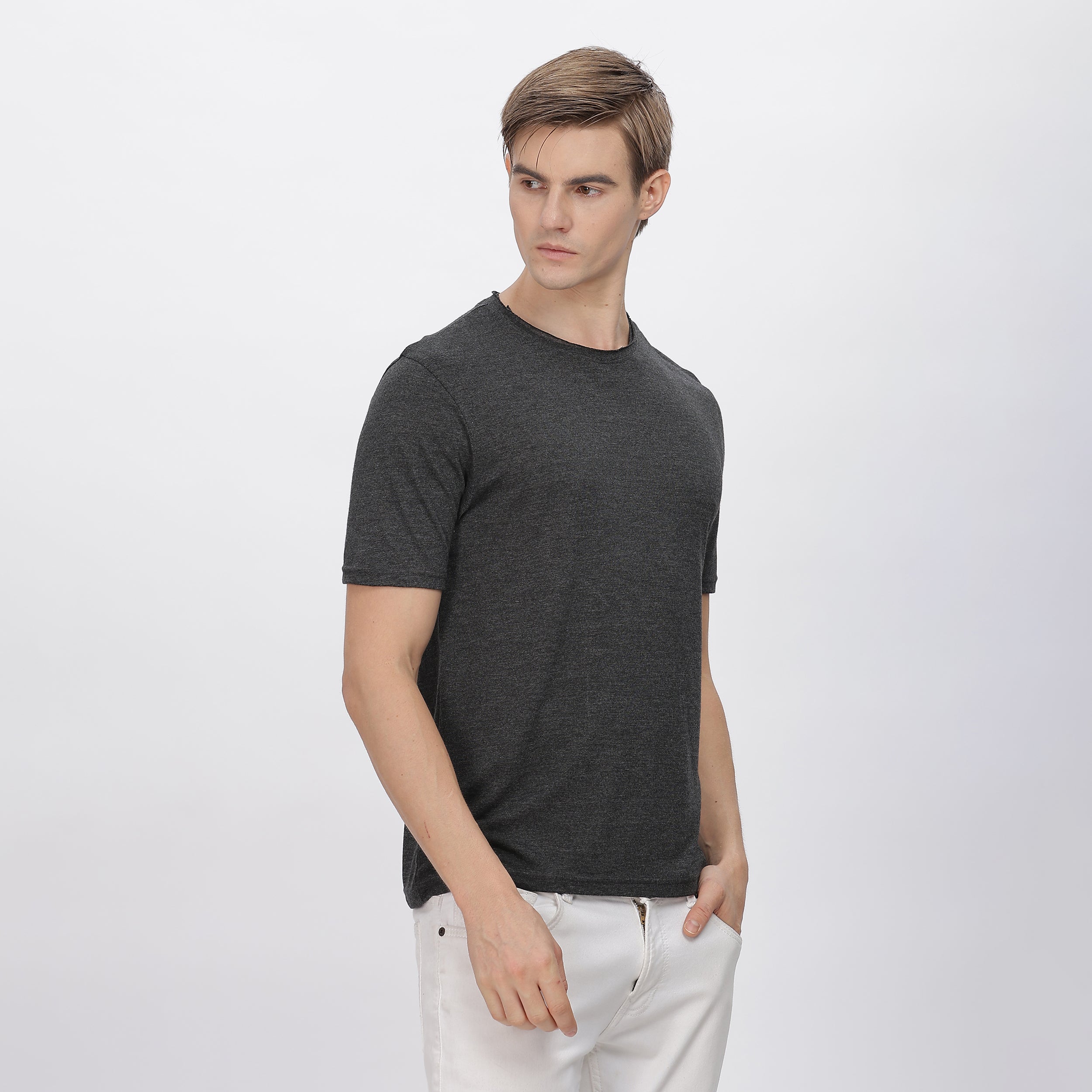 Back view of grey polyester shirt, showcasing durable stitching and a relaxed fit.