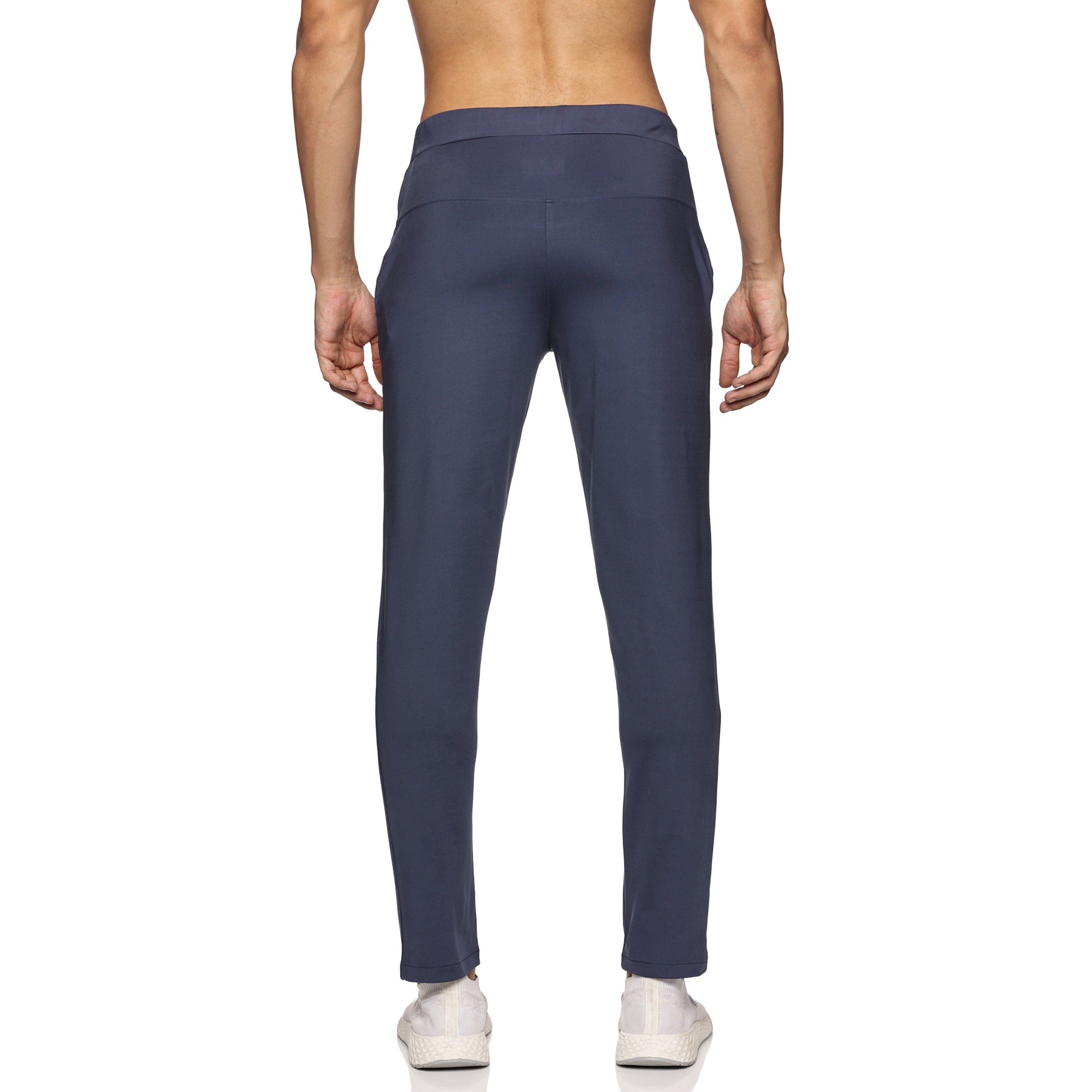 Close-up of men’s track pants in navy blue with zipper closure