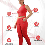 Red joggers and crop top set, displaying modern design and breathable fabric.