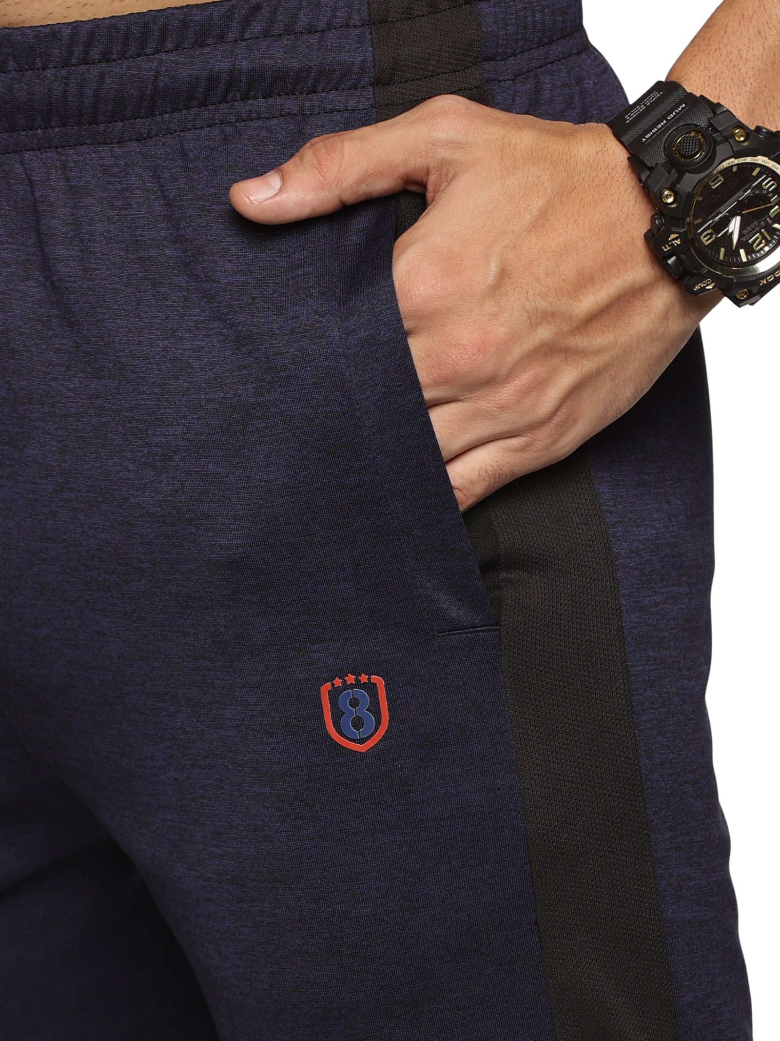 Side view of men’s slim fit track pants with contrasting panels