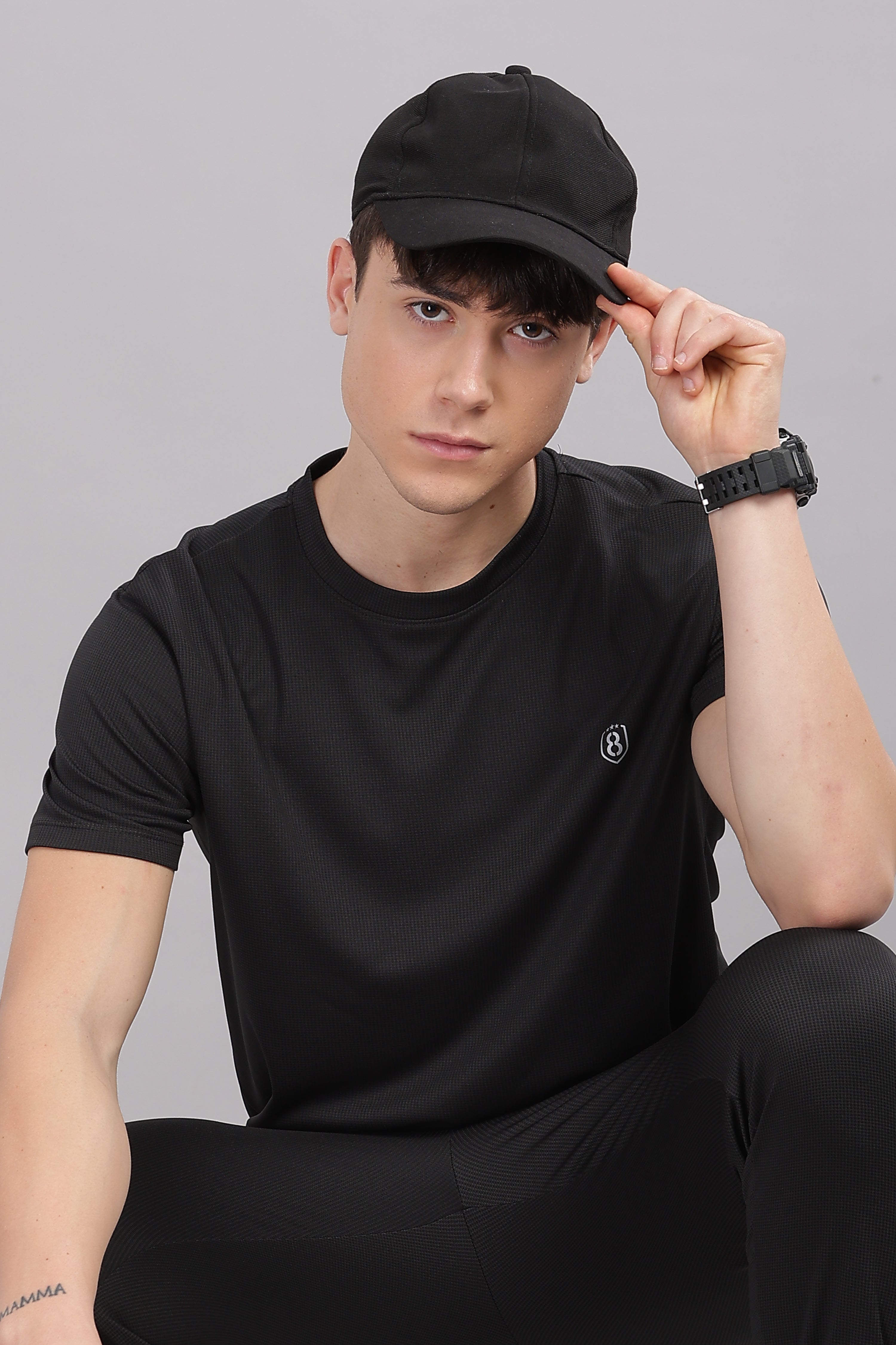 Side view of modern black co-ord set with matching shorts for men