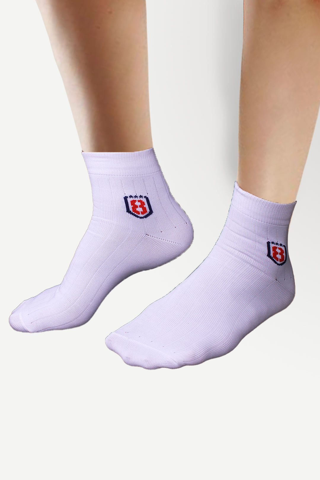 Back view of nylon white socks with rubber grip, designed for comfort and stability.